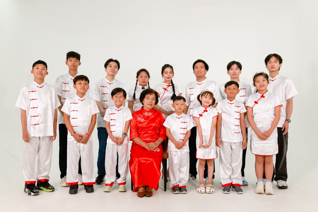 Person reviewing insurance paperwork with calculator