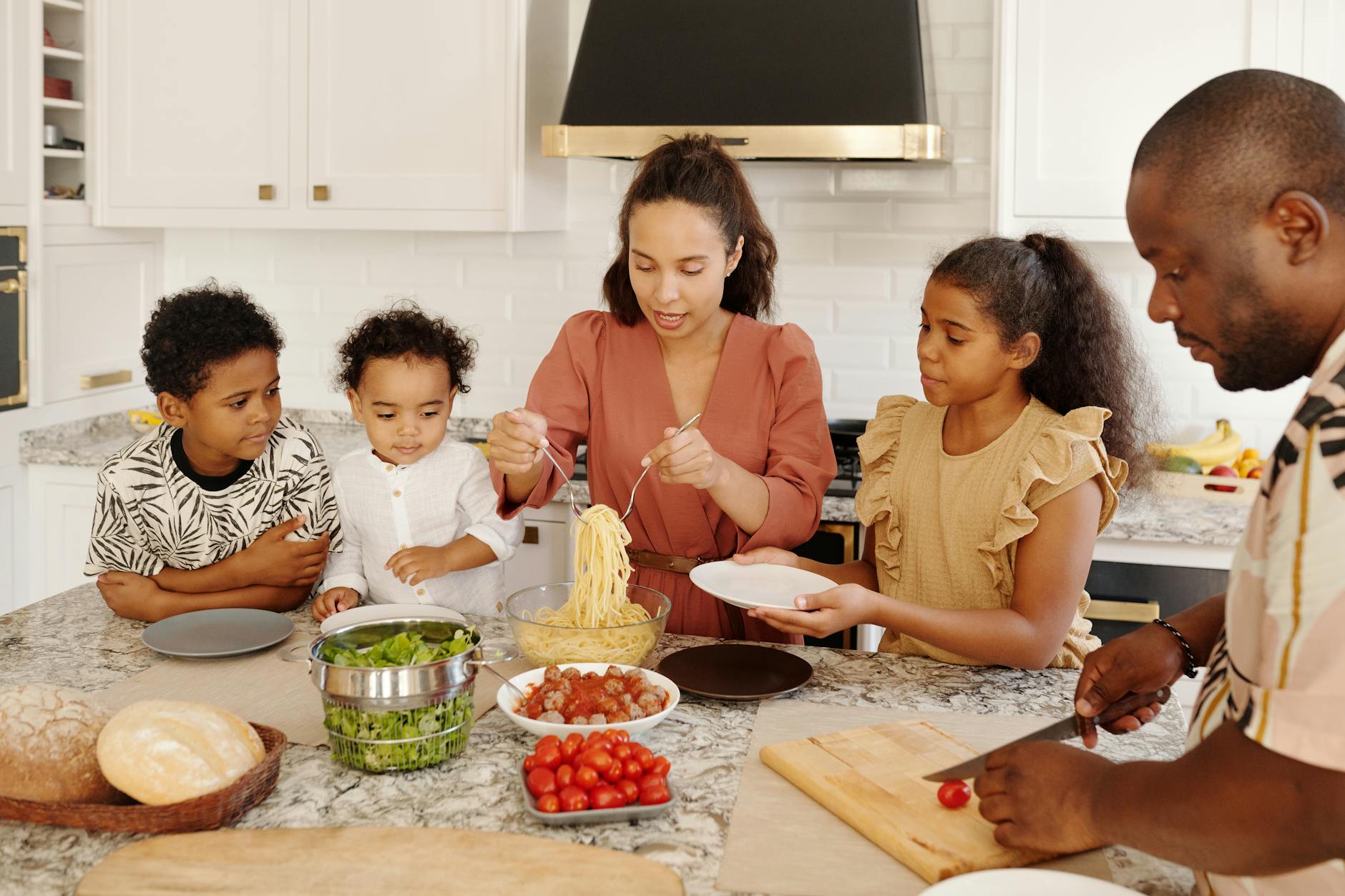 Family reviewing financial documents together at kitchen table